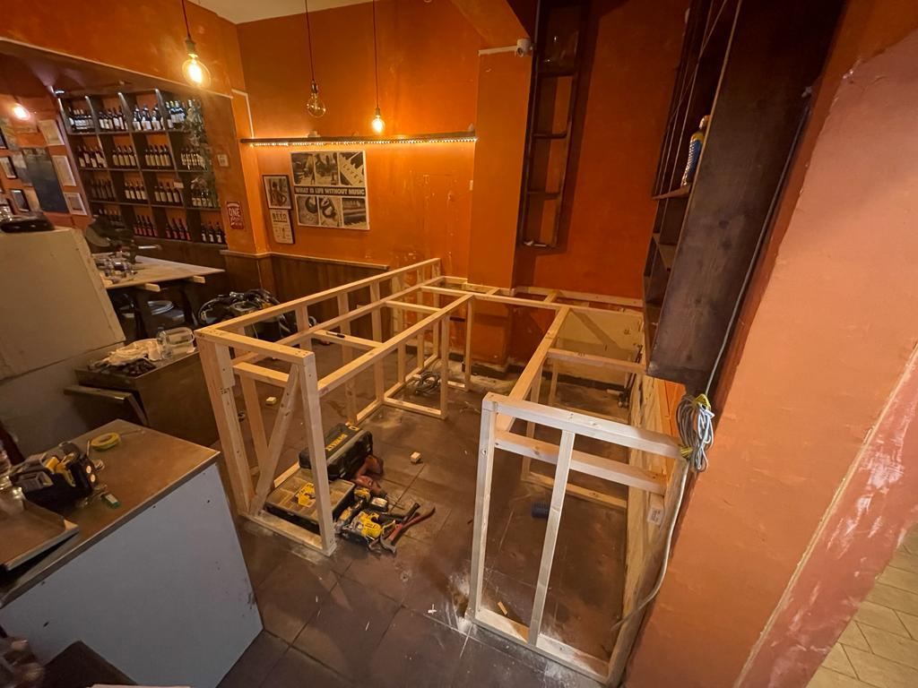 The new bar framed out on site to set the run and serving height.