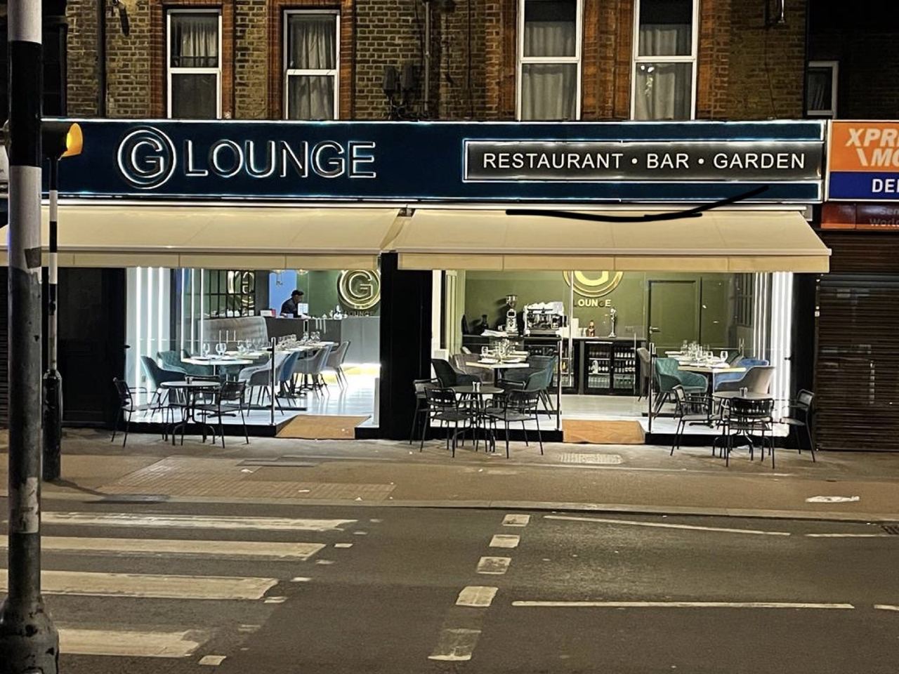 G Lounge: folding glazed shopfront opening onto the street