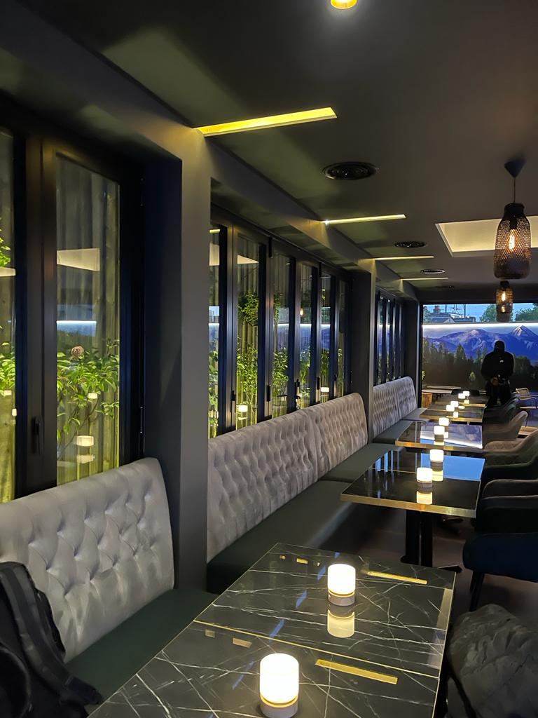 G Lounge: banquette seating running the length of the windows