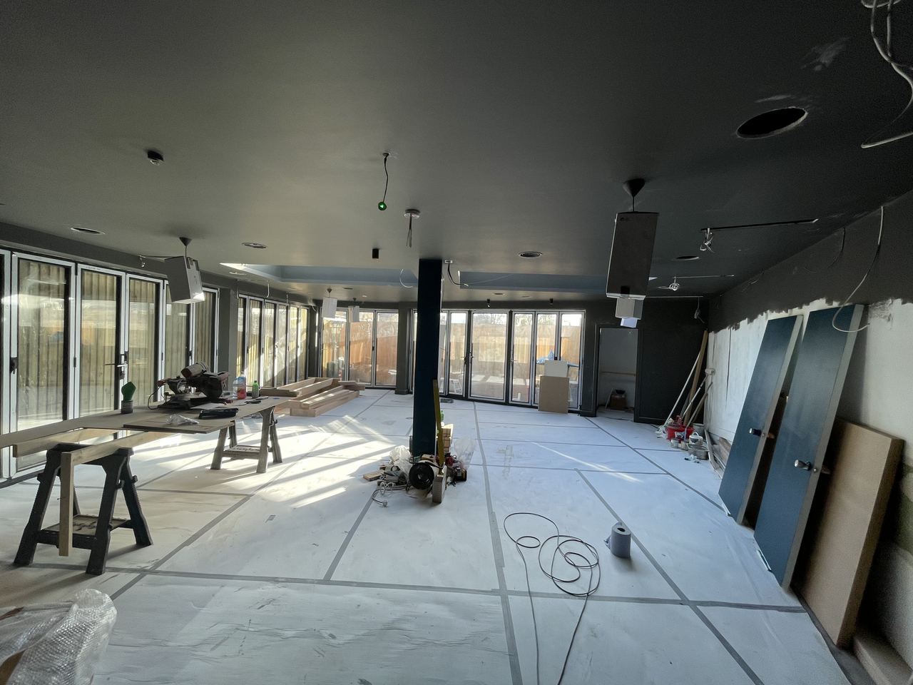 Floor laid and the space emptied out, ready for furniture and final fit.