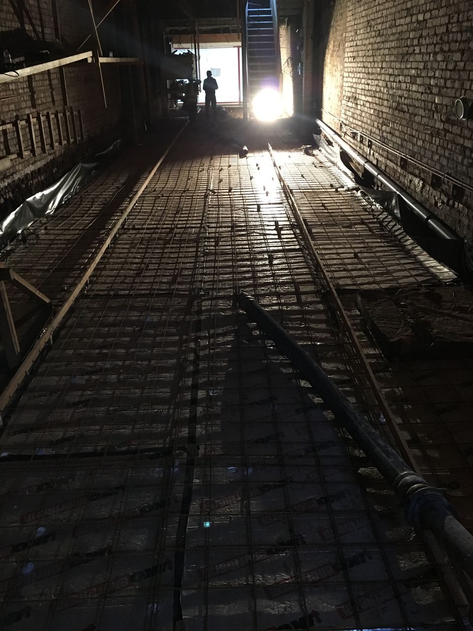 Excavated down below the old floor level, ready to rebuild.