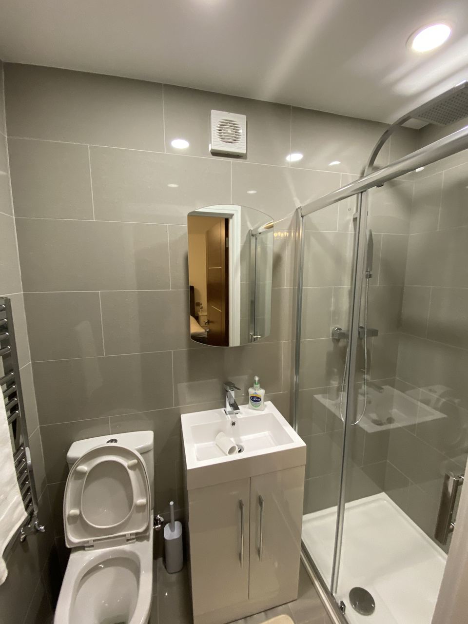 Shower room with glass screen and vanity