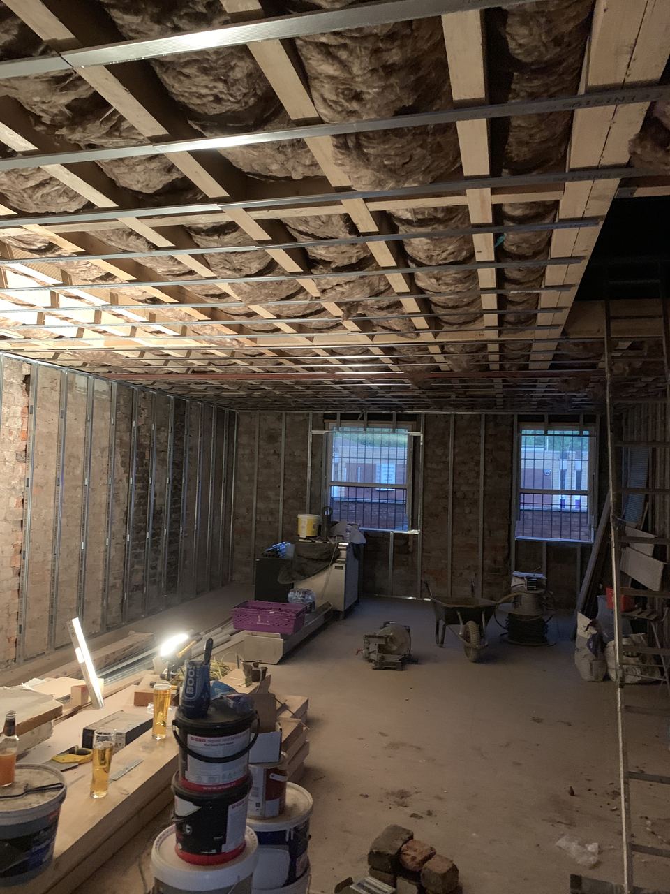 Interior stripped back: ceilings down and joists exposed.