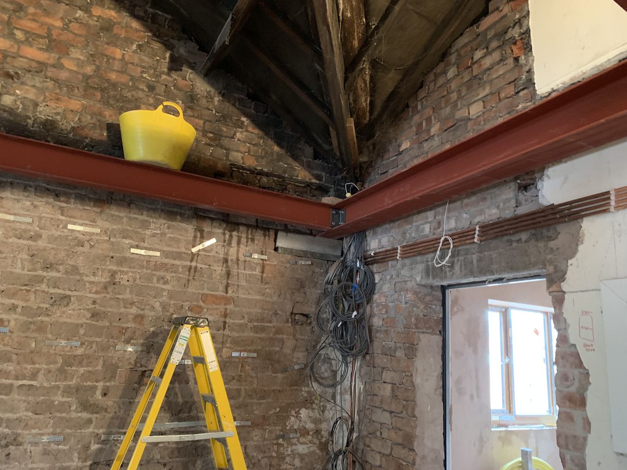 Structural steel installed to open up the ground floor.