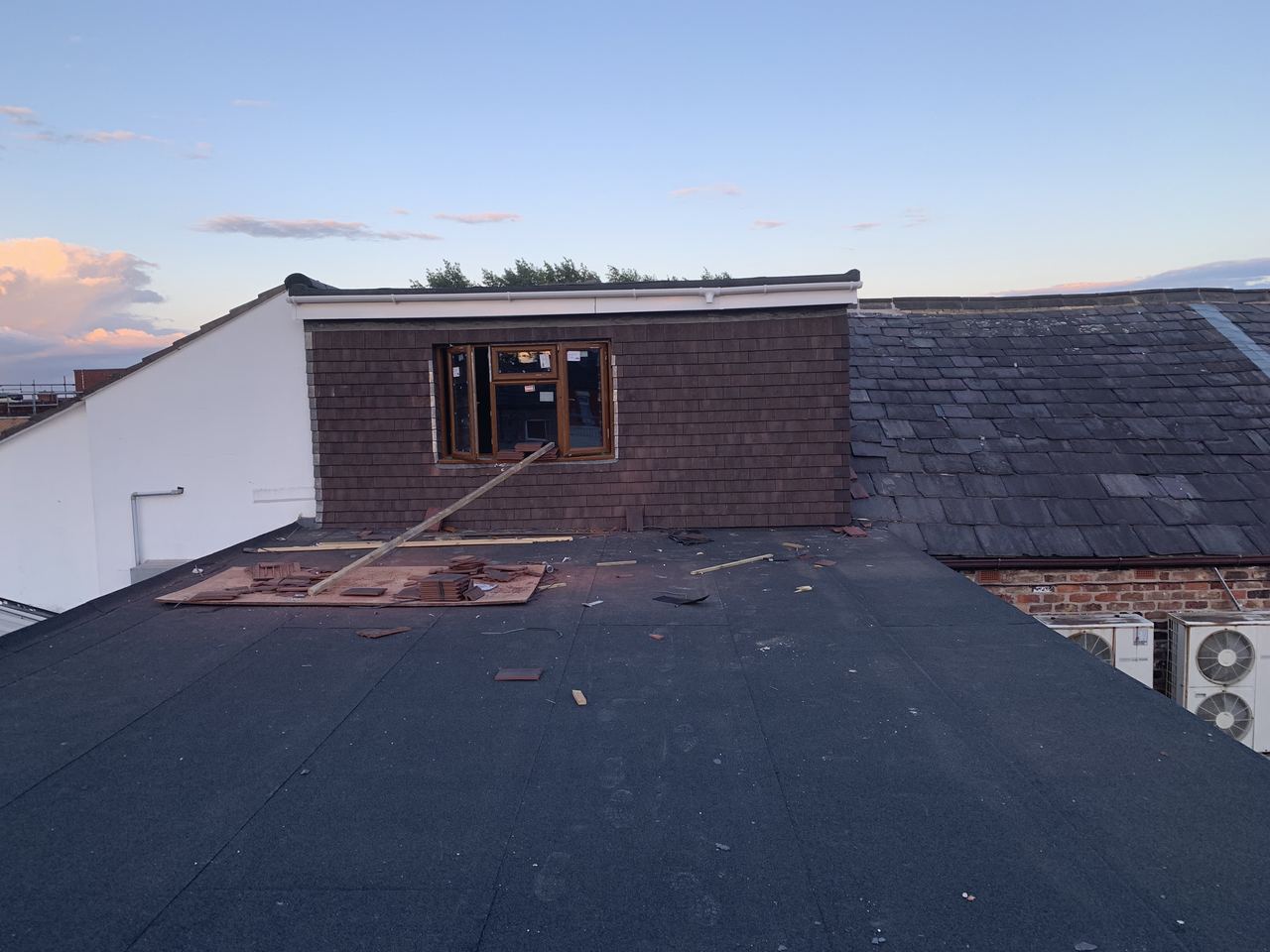 The new dormer and flat roof covering complete from outside.
