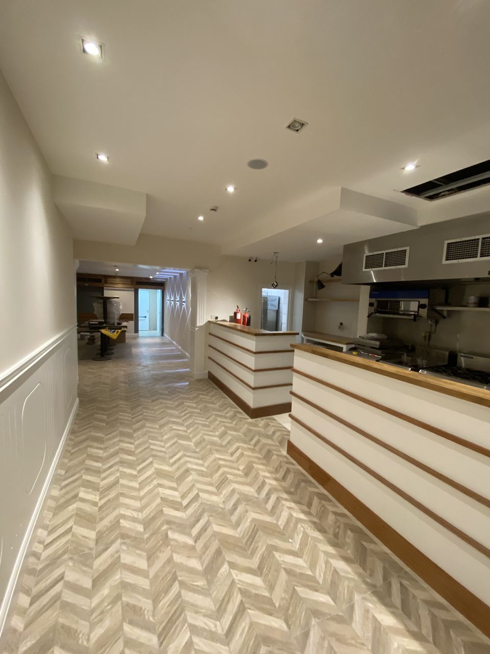 Milano Pizzeria: dining room with panelled walls and herringbone flooring