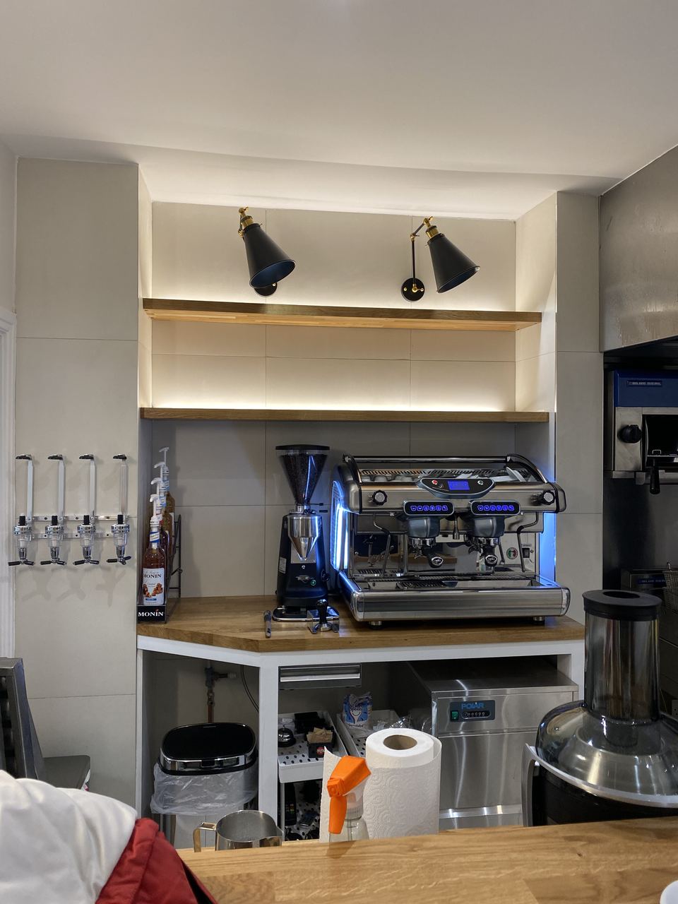 Milano Pizzeria: coffee station with fitted shelving above