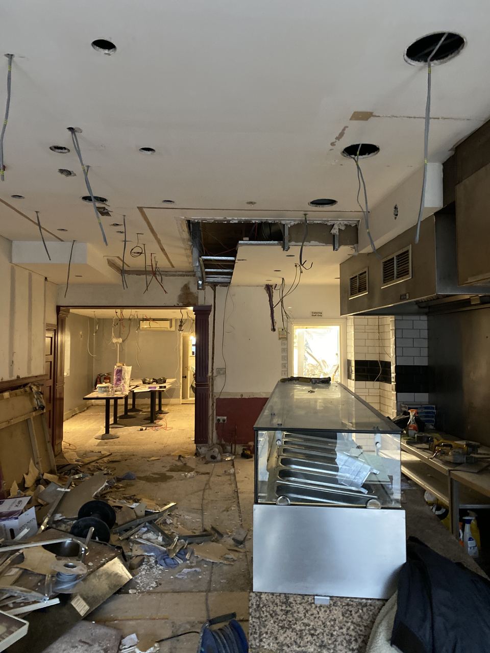 The unit as we found it, debris throughout and old equipment stripped out.