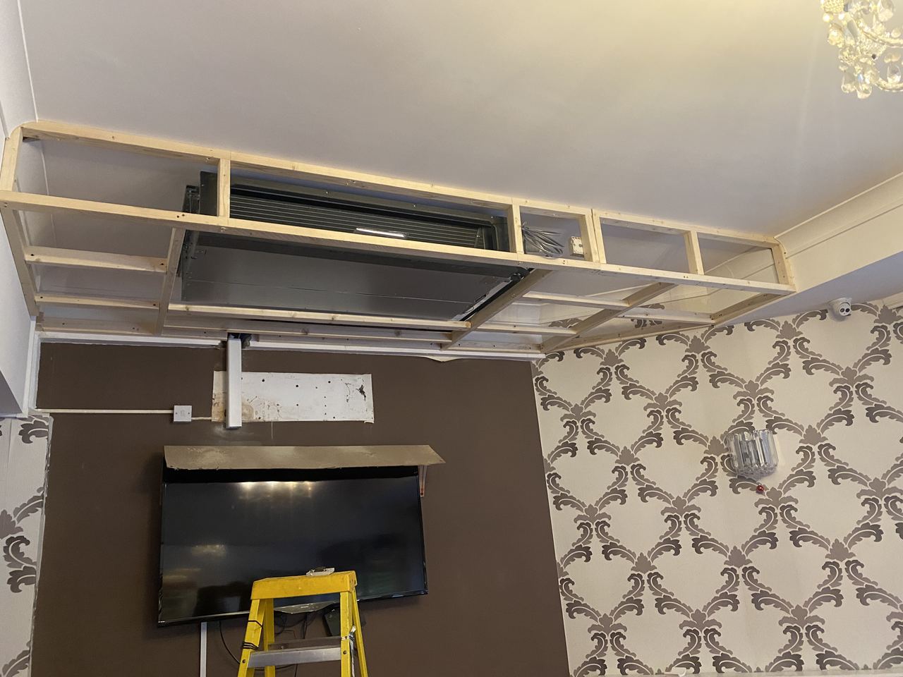 Oasis: ceiling unit lifted into the void