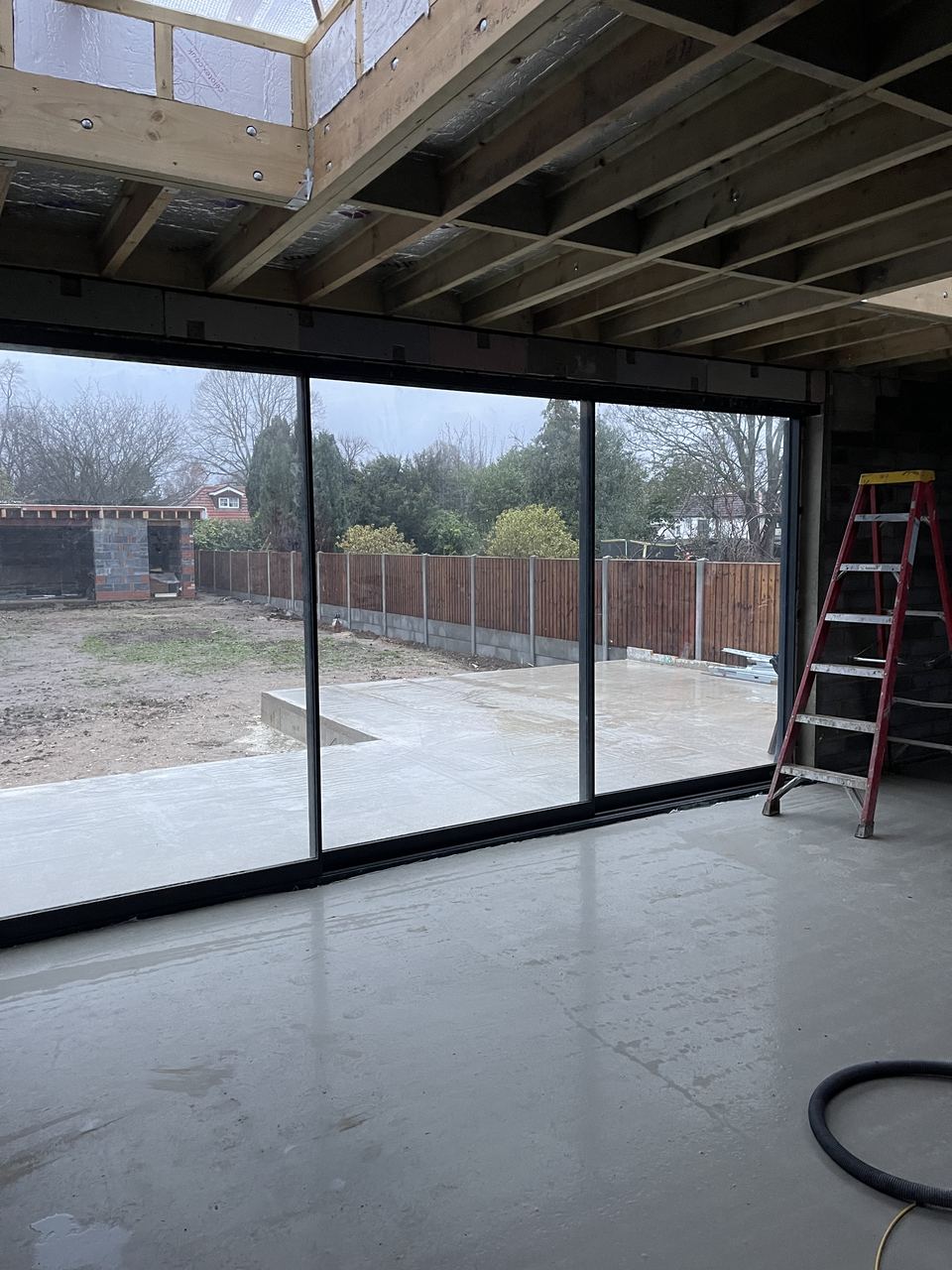 Extension, Loft Conversion & Summer House, sliding glazing opening the ground floor onto the garden