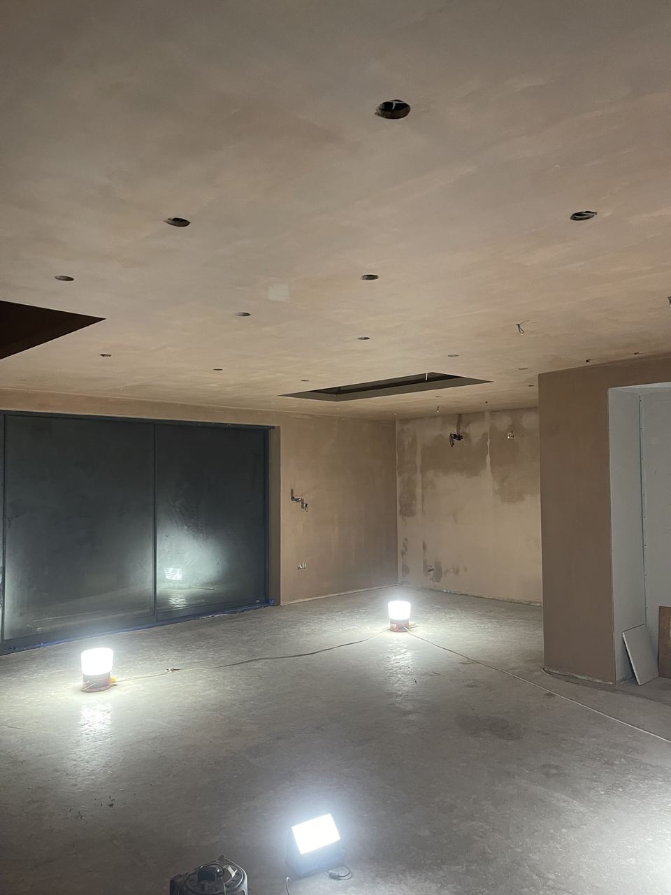 Extension, Loft Conversion & Summer House, re-plastered reception room ready for decoration
