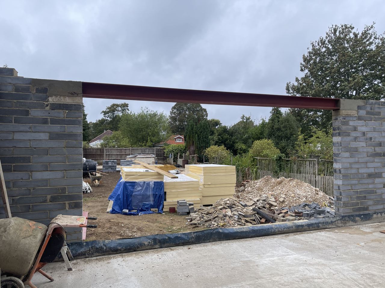 Steel beam spanning the new blockwork piers across the rear.