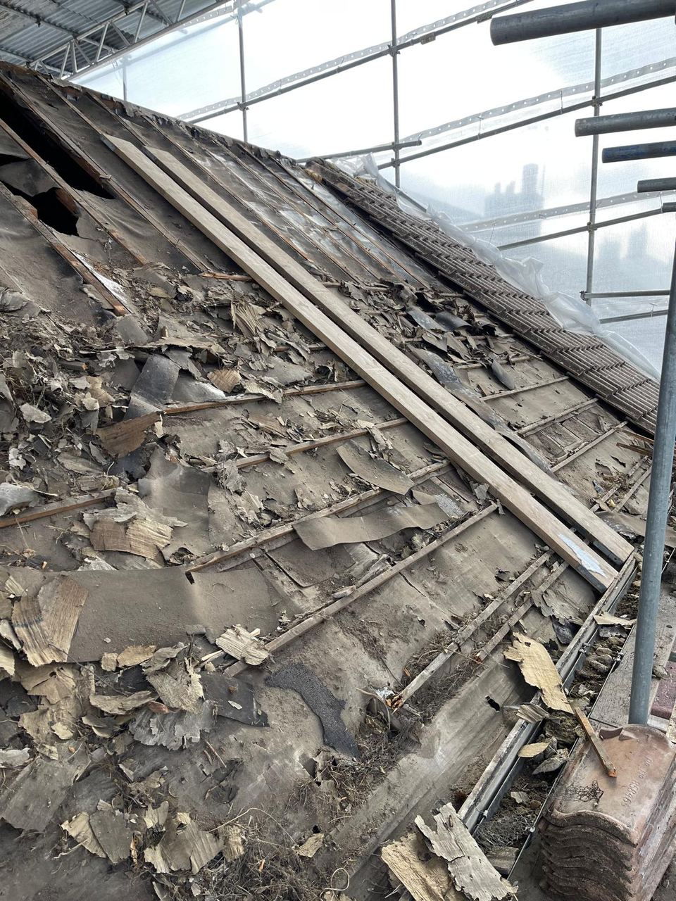 Roof stripped back to the rafters before rebuilding.
