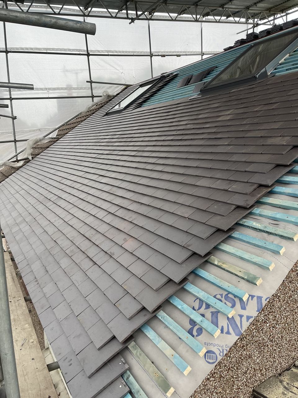 The rebuilt roof re-tiled and weathered in.