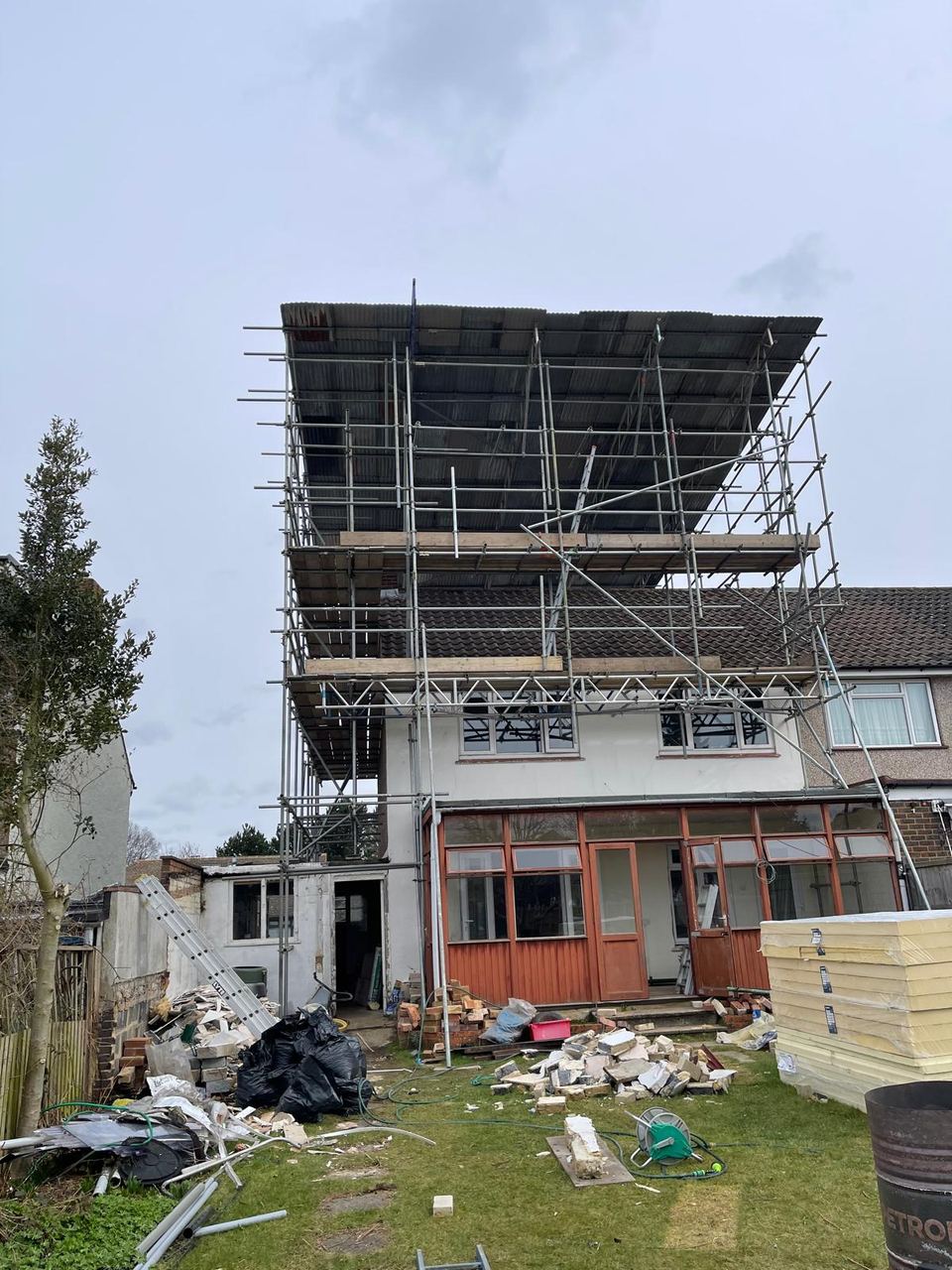 The rear elevation scaffolded with the loft extension under way.