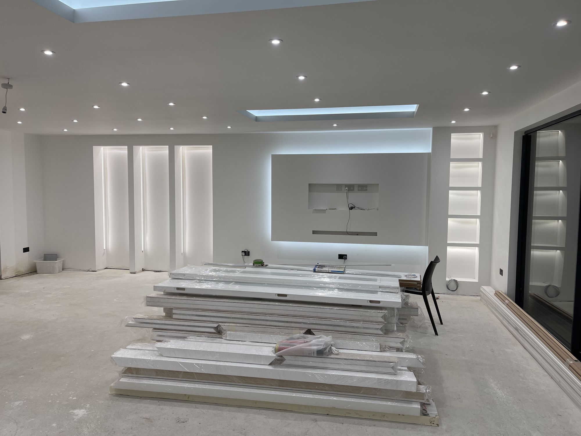 Completed open-plan living space with skylight and new glazing