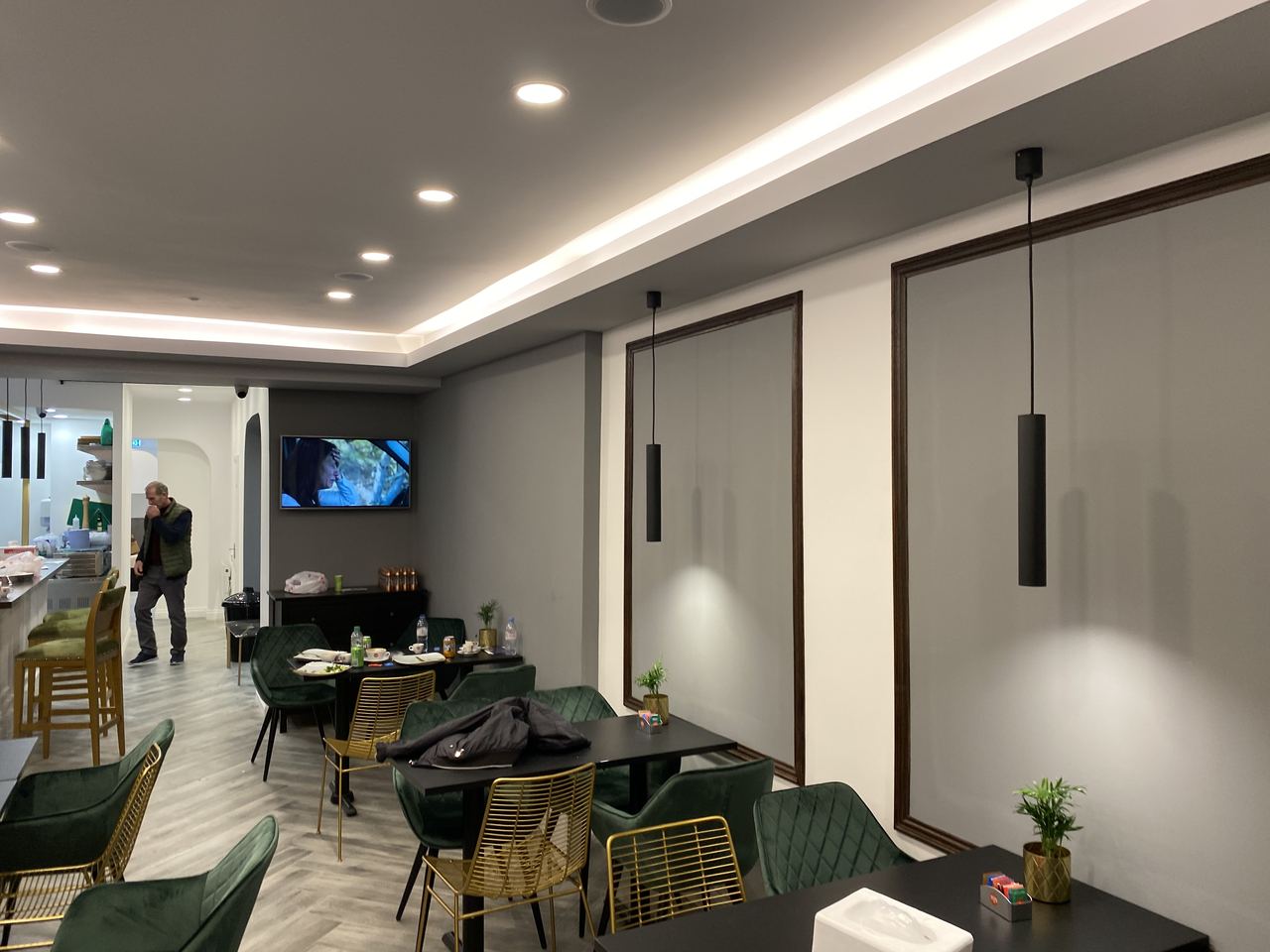 Wake Up Lounge: seating area beneath the cove-lit ceiling detail