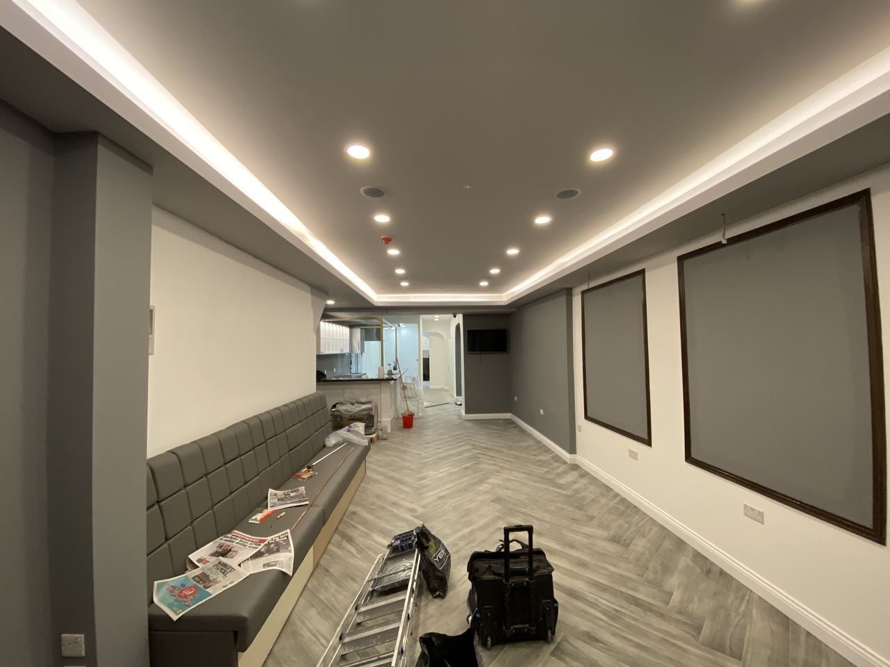 Flooring laid and cove lighting in, ahead of furniture.